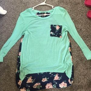 Blue long sleeved shirt. Longer floral back. Rue21 Medium